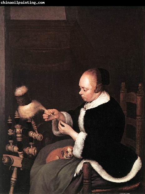 TERBORCH, Gerard A Woman Spinning at