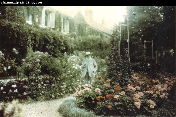 Claude Monet Monet in his garden at Giverny