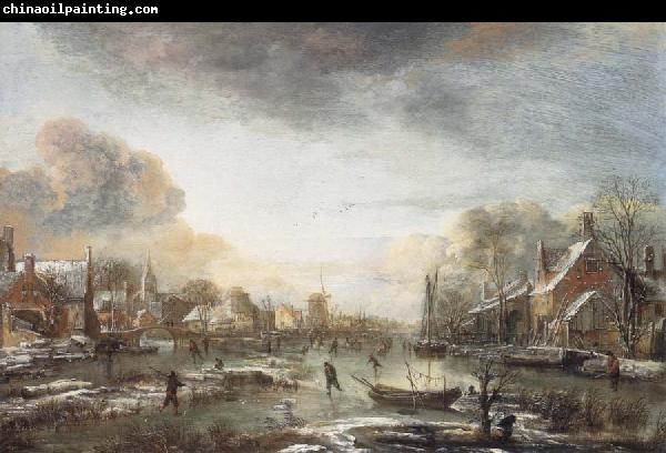 Aert van der Neer A Frozen River by a Town at Evening