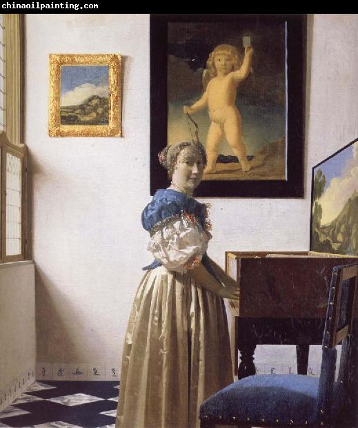 JanVermeer A Young Woman Standing at a Virginal