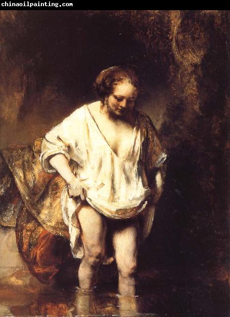 REMBRANDT Harmenszoon van Rijn A Woman Bathing in a Stream