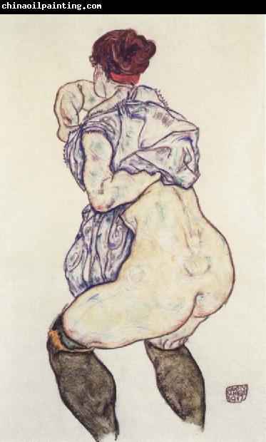 Egon Schiele woman undressing