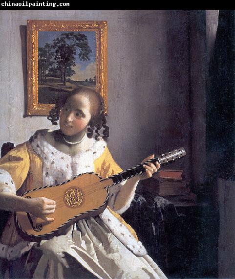 Johannes Vermeer Youg woman playing a guitar