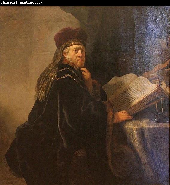 REMBRANDT Harmenszoon van Rijn A Scholar Seated at a Desk