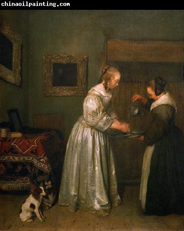 Gerard ter Borch the Younger A lady washing her hands.