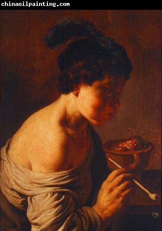 Jan lievens A youth blowing on coals.