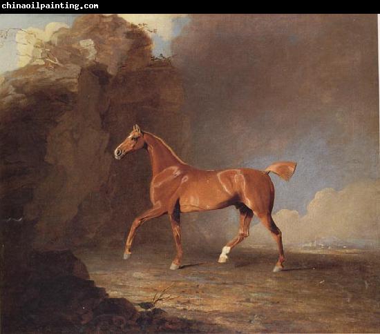 Benjamin Marshall A Golden Chestnut Racehorse by a Rock Formation With a Town Beyond