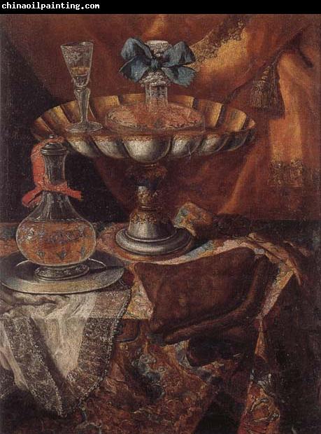 unknow artist Still life of a wine glass and bottle in a parcel gilt tazza together with a glass decanter on a pewter dish upon a draped tabletop