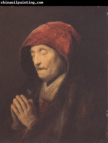 REMBRANDT Harmenszoon van Rijn An old woman at prayer (mk33)